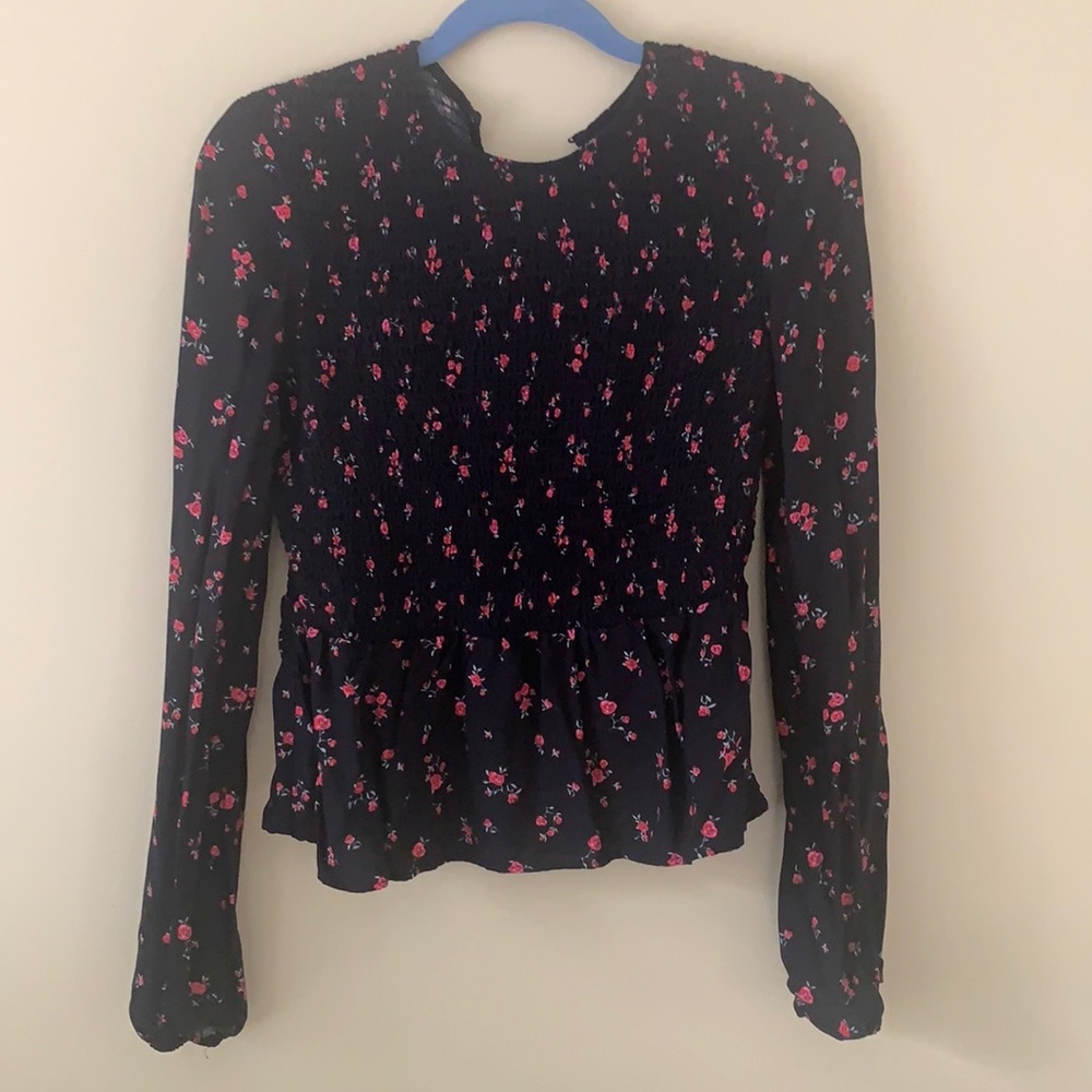 Smocked long sleeve peplum blouse